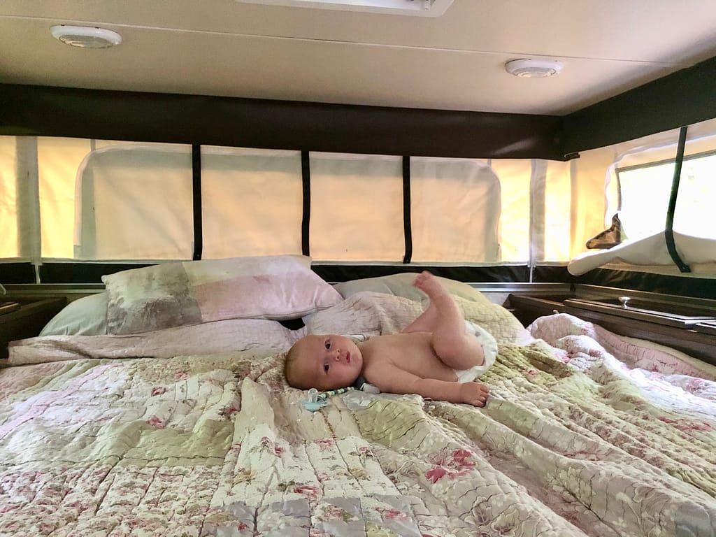 travelling after kids - baby in truck camper camping