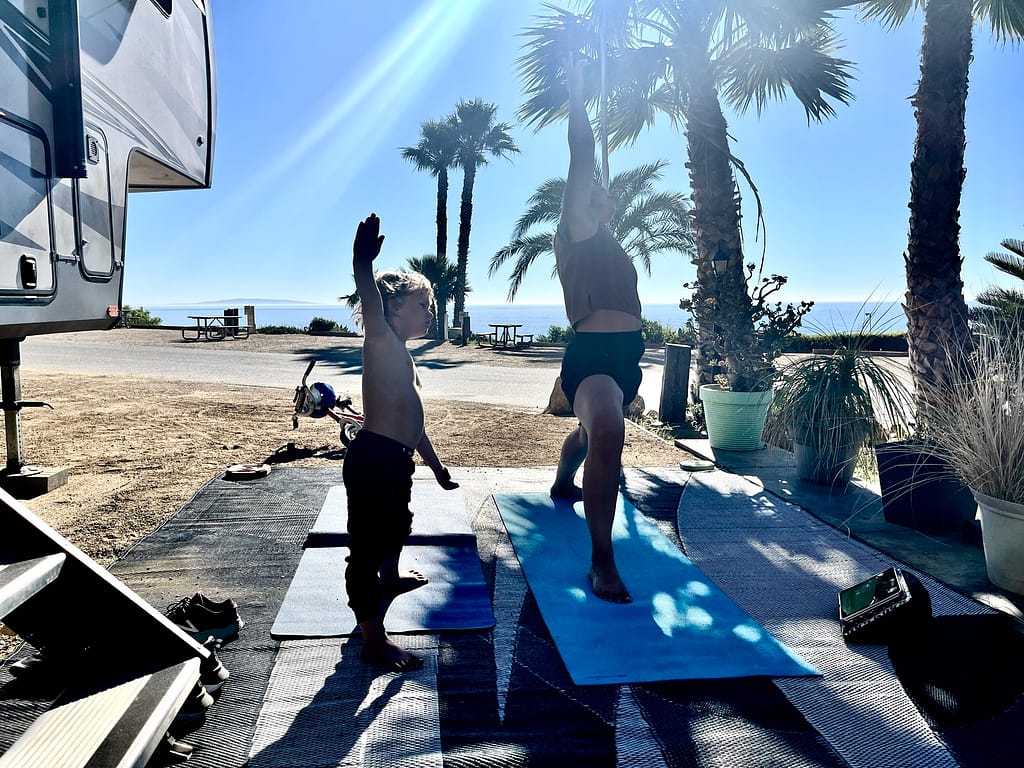 doing yoga outside in malibu by the pacific ocean on my yoga journey