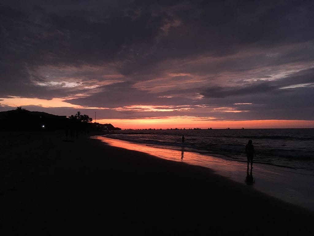 sunset over pacific ocean mancora beach peru