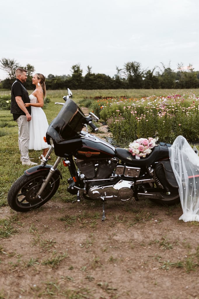 blog post our wedding story bride and groom cuddling in flower fields