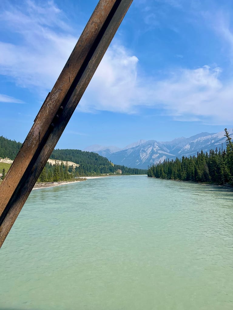 rv road trip across canada mountain and river views from a bridge in jasper national park alberta